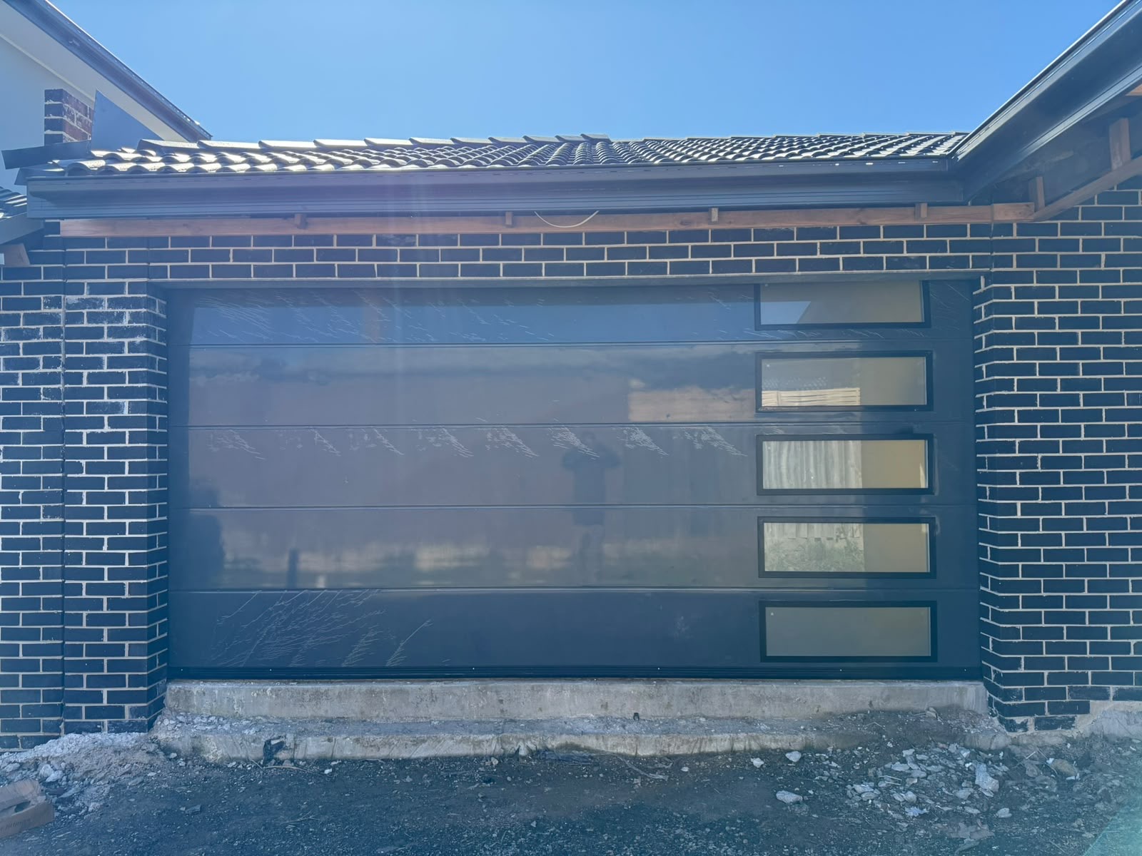 Full-view glass garage door with side windows